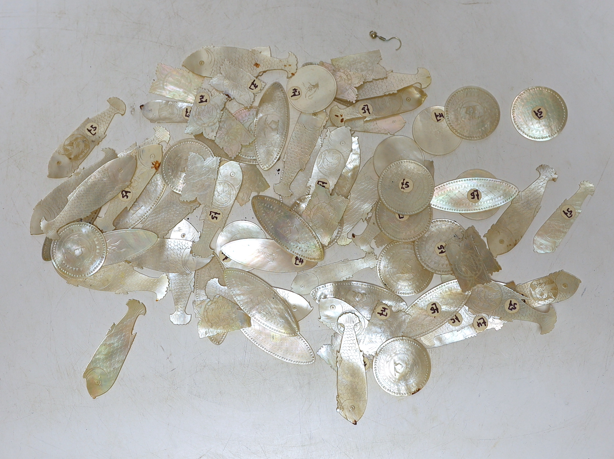 A collection of Chinese mother of pearl gaming counters